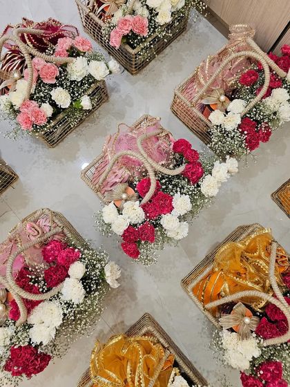 Sharing some more of my work from the Diwali season. How stunning do these gota potlis look, nestled in jute baskets with fresh, colorful carnations? A perfect festive touch.