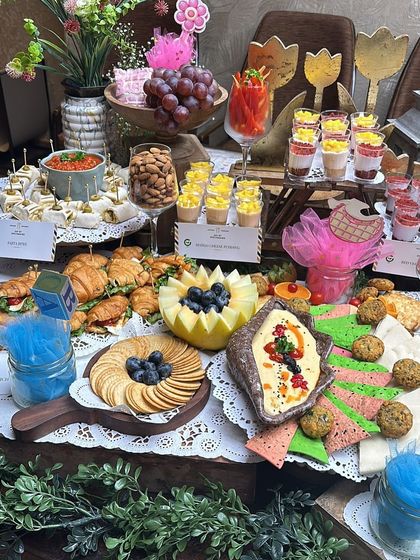 This view highlights the variety on our baby shower grazing table, from mini croissants and dessert shots to fresh fruit displays and cheese boards, ensuring there's a treat for every guest.