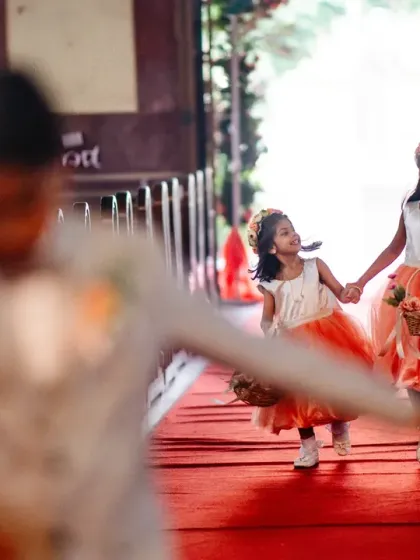 The flower girls make their way down the aisle, a sweet and important part of the ceremony.