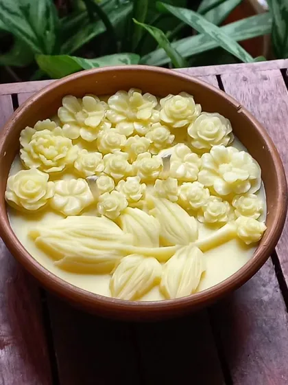 The beauty of our Mitti Bowl Candle, seen from above. The arrangement of hand-poured wax flowers creates a stunning visual texture, promising a beautiful melt pool as it burns. It’s the simple things that bring the deepest joy.