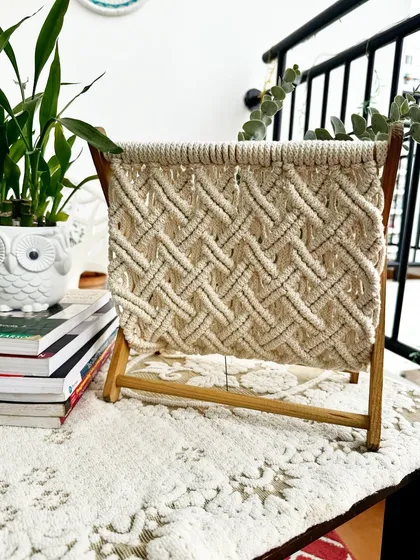 I designed this macrame magazine holder to be both beautiful and useful. It features a sturdy wooden frame and a tightly woven pocket to hold books, magazines, or newspapers, keeping your living space tidy and stylish. It’s a perfect example of functional home decor.