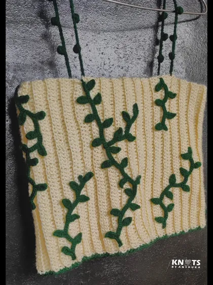 My ivy crochet top, inspired by nature. I hand-stitched the green vine details onto the cream-colored ribbed top.