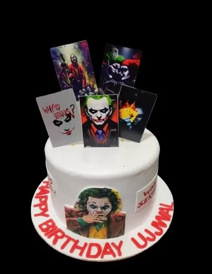 "Why so serious?" This Joker-themed cake is perfect for a fan of the iconic character, featuring various portraits and a striking red and white design.
