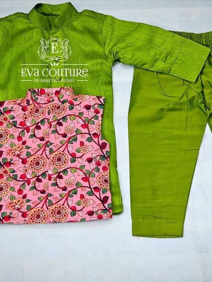 A three-piece kurta set for boys. It includes a lime green raw silk kurta and pajama, with a contrasting pink printed Nehru jacket.