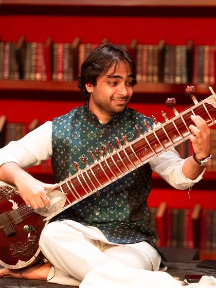 A moment of joy during a performance with my band at a beautiful venue in Bangalore. I love connecting with the audience through my music, whether it's a soulful raag or an energetic fusion piece.