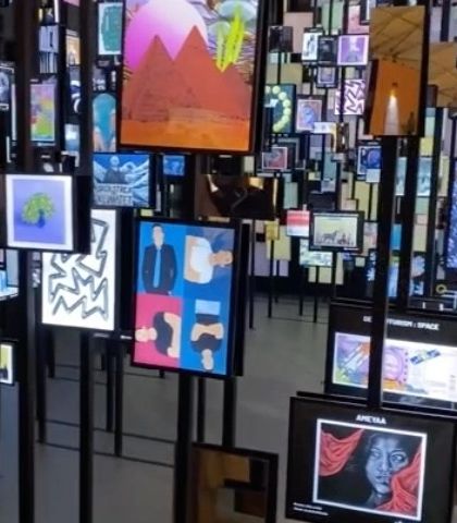 A close-up of the NFT screens in the 'Artify' installation. The variety of digital artworks displayed showcases the diversity and creativity of the metaverse, brought into a physical, explorable space.