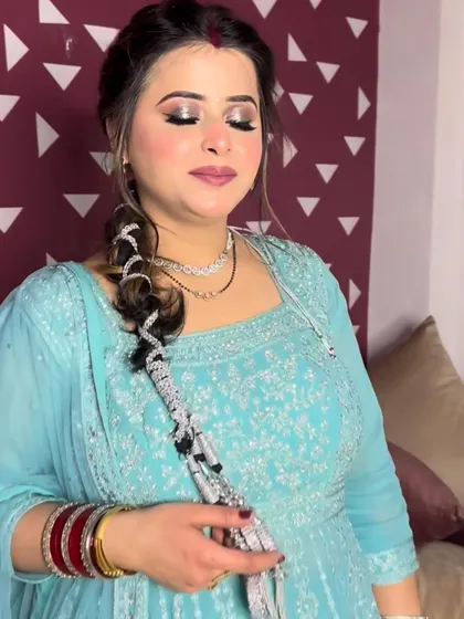 A close-up of a glittery eye makeup look, perfect for a party. The braided hairstyle adds a touch of intricate detail.