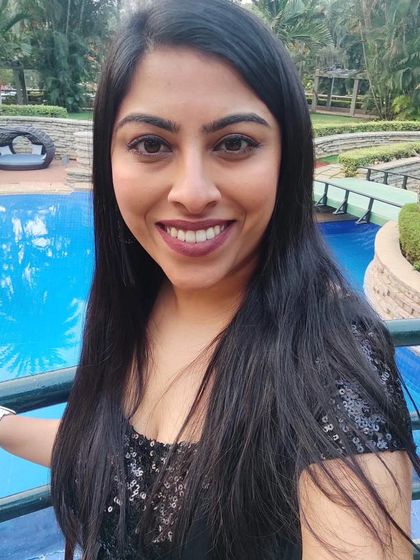 A relaxed moment before hosting an evening event. Even in a glamorous setting, I remain approachable and focused on delivering a flawless experience.