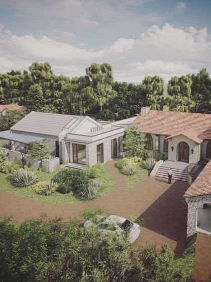 An aerial view of "The Abbey House" render, emphasizing its connection to the surrounding landscape and the way it breaks down its large scale into a more human-centric collection of buildings.