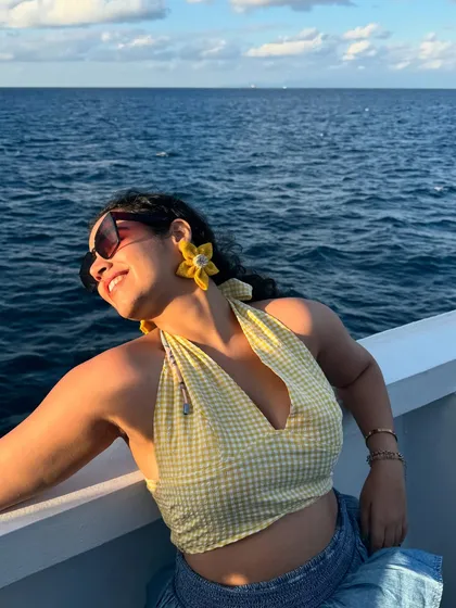 Another shot of me enjoying the sea breeze. The yellow in my outfit just adds to the sunny, happy mood.