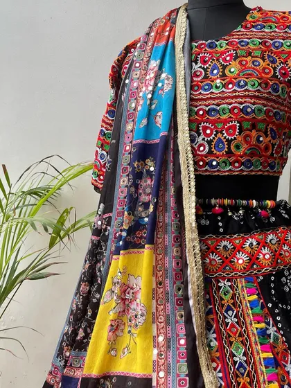 A close-up of the multi-colored dupatta, featuring beautiful floral prints and sequin details.