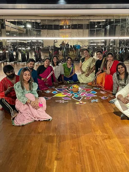 Our group gathered around a beautiful rangoli. We incorporate traditional elements to make our celebrations authentic and memorable.