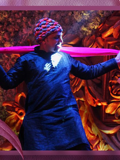 A performer owning the stage during a family sangeet. We help every family member find their inner dancer and deliver a performance they can be proud of.