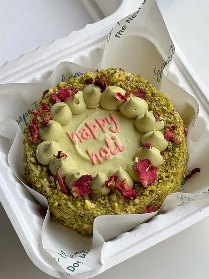 For Holi, I created this exclusive Thandai Pistachio mini cake. It's a delicious and festive flavor combination, decorated with crushed pistachios and dried rose petals.