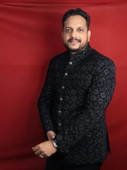 This black Jodhpuri jacket with a geometric pattern is a modern take on traditional wear. It's a great rental option for a cocktail party or reception.