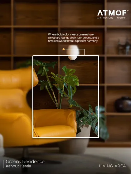 We love creating moments of perfect harmony. In this living area, a bold mustard lounge chair is balanced by the calming presence of lush green plants and a timeless wooden wall.