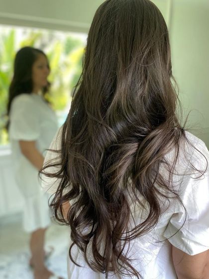 A back view of the trendy layered haircut, showcasing the volume and texture that makes it perfect for summer.