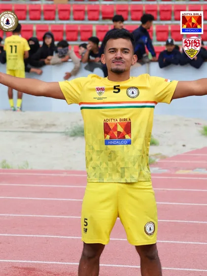 A champion's pose. One of our players celebrating the Climate Cup victory, a reward for his passion and perseverance.