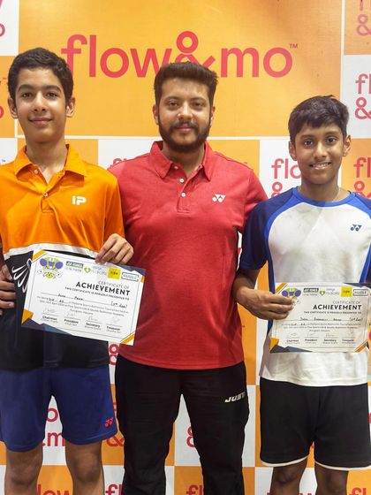 Two more champions from my academy holding their trophies and certificates. Their success is a direct result of their commitment to the grind.