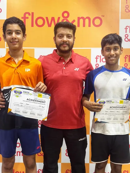 Two more champions from my academy holding their trophies and certificates. Their success is a direct result of their commitment to the grind.