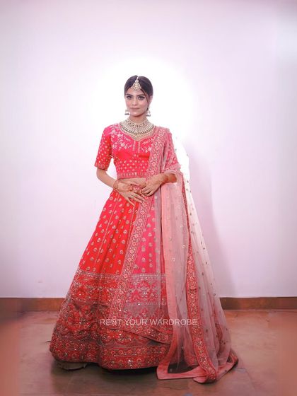 A full view of this elegant pink lehenga. The delicate embroidery and soft color make it a versatile choice for engagement or bridal looks.