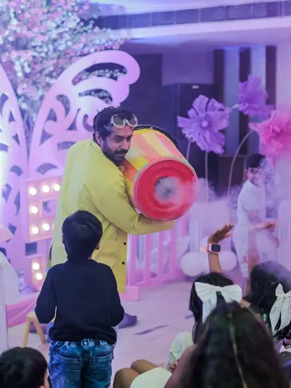 My mad science shows are always a hit! Here, our entertainer creates a huge cloud of smoke, delighting the kids with a safe and spectacular chemical reaction. It's educational fun that leaves everyone amazed.