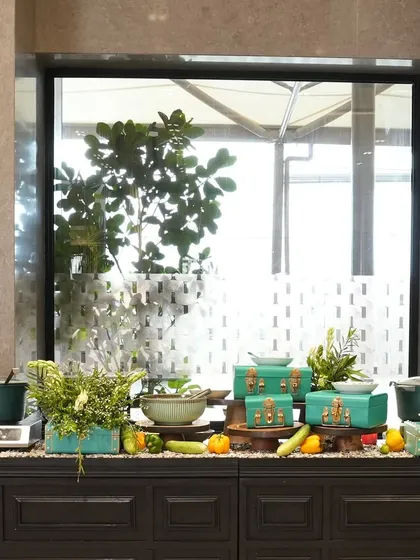 A colourful and contemporary buffet station with turquoise accents. We design our setups to match the event's colour palette, ensuring a cohesive and visually appealing experience.