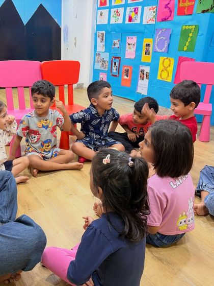 A typical day in our class involves group discussions and storytelling circles, where children learn to listen, take turns, and share their ideas.