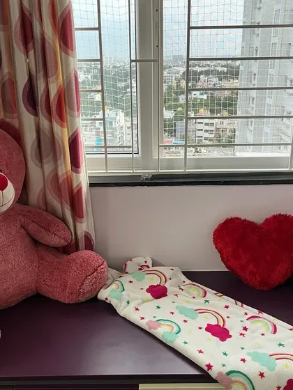 This cozy window seat was once a dumping ground for clutter. Now, it's a peaceful spot for a child to relax, read, and play. Creating these calm-down corners is a key part of making a room feel balanced and inviting.