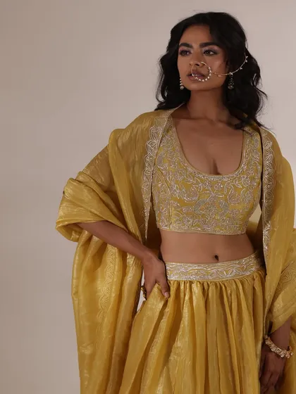A stunning yellow lehenga with intricate silver embroidery. I paired it with a traditional nose ring to create a beautiful look suitable for a Haldi or Mehendi ceremony.