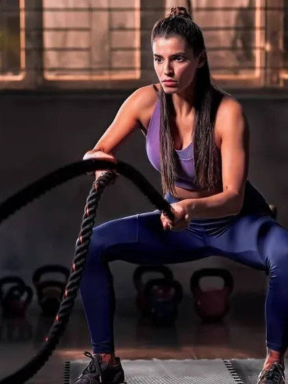 Another shot from the athletic campaign. The focus is on clean skin and lightly defined features, ensuring the makeup enhances the model's determined expression during a workout pose.