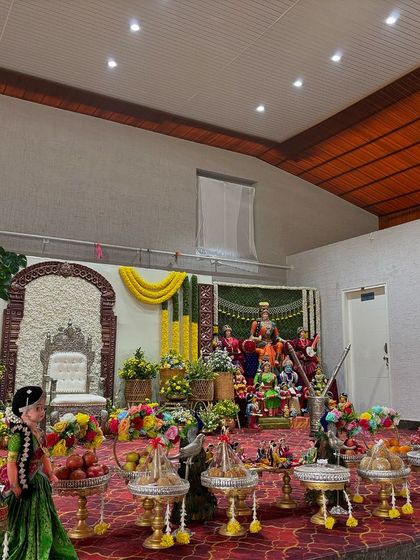 A combined stage and Golu setup for a home or small hall ceremony.