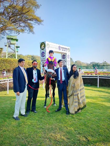 El Rey, with jockey David Allan, poses with the Queen's Gambit Racing Syndicate.