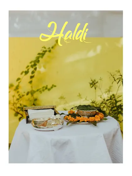 A simple, elegant shot of the Haldi ceremony setup, focusing on the traditional elements.