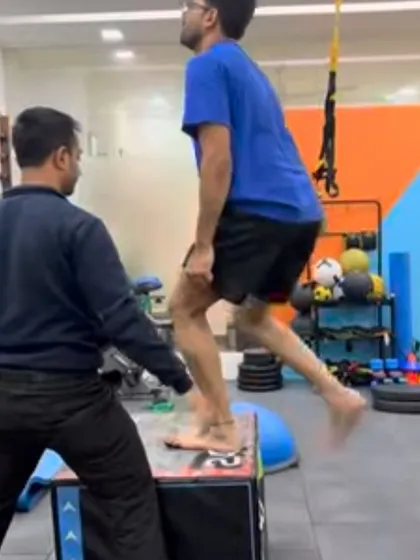 Dr. Godin S. Kuruvilla, Head of our Gulmohar Park branch, supervises a patient during a plyometric box jump. This demonstrates our hands-on approach to ensuring exercises are performed safely and effectively.