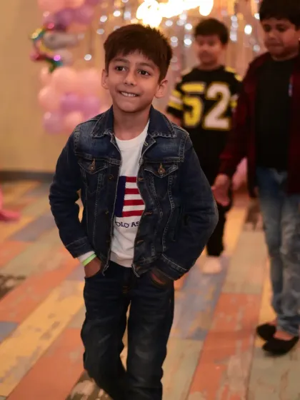 A young guest looking cool and confident. The party atmosphere brings out the best in everyone.