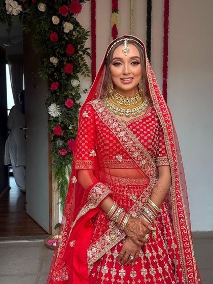 The bride is all smiles, ready for her big day. Her hair looks perfect, and the style will last throughout the ceremony and reception.