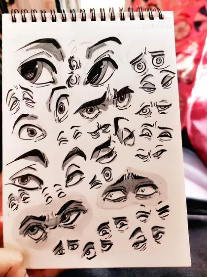 A page full of eye studies. I love exploring different styles, from realistic to cartoonish, to see how I can convey emotion.