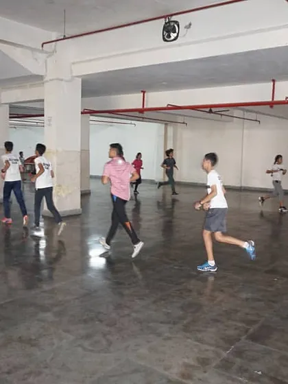 A group of fencers running laps in our training facility. Building stamina is a non-negotiable part of our competitive fencing program.