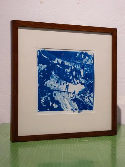 An abstract botanical cyanotype, framed and ready for the client. Commissions allow us to explore different subjects and tailor our art to a specific aesthetic.