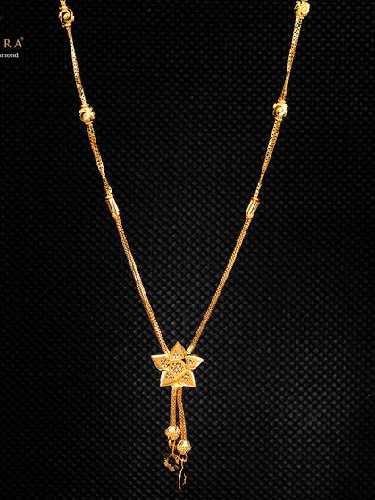 This lightweight gold necklace features a star-shaped pendant with dangling beads. It's a modern and chic design that appeals to customers looking for stylish yet affordable gold jewellery.