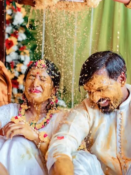 A duplicate of 187, a great candid shot of the couple's reaction during a messy Haldi.