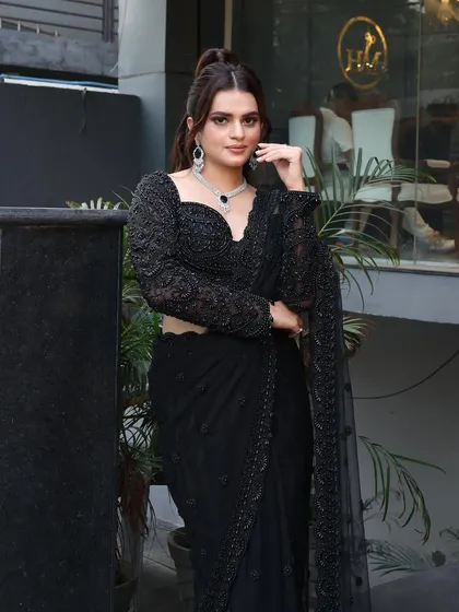 For a chic reception or sangeet, I crafted this elegant look featuring a high ponytail and sophisticated makeup. The focus is on sharp, defined features and a matte finish that lasts all night.