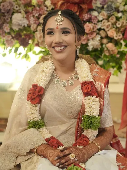A close-up of the bride's happy face, her smile infectious and her makeup glowing.