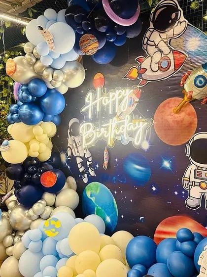 Another angle of the 'First Trip Around the Sun' birthday theme, showcasing the full circular backdrop and balloon arrangement.