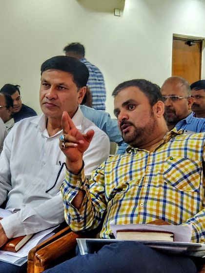 A member of the audience engages in a lively discussion during my seminar. These interactive sessions help me understand the specific concerns of industries regarding CAQM regulations, technology, and cost, allowing me to provide tailored advice.