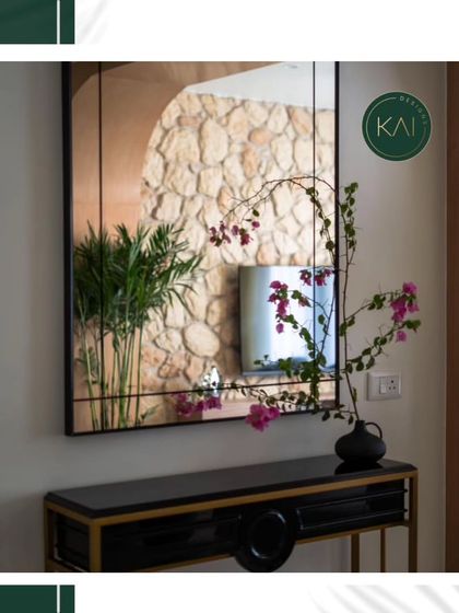 Our black and gold console table, shown here styled in an entryway with a large mirror. Its sleek design makes it a perfect landing strip for keys and decor without taking up too much space.