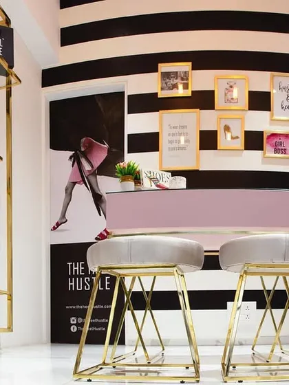A throwback to a fun retail project for a luxury shoe store. We used bold black-and-white stripes, gold accents, and a touch of pink to create a chic and glamorous space that makes shoe shopping feel like an event.