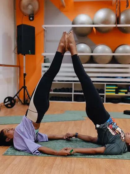 Finding perfect symmetry and balance with a partner. These shared yoga poses are a fun way to deepen your stretches and improve alignment together.