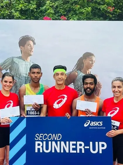 Team Trackblazers on the podium after securing the second runner-up position at the Asics Gel Kayano 31 relay event. Our team of three competed against 45 other teams to earn this spot.
